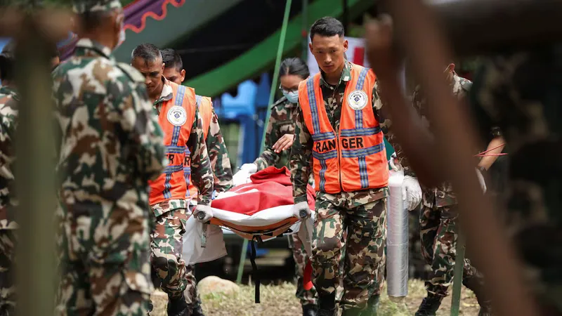 Nepal flood rescuers find two alive at Trishuli project
