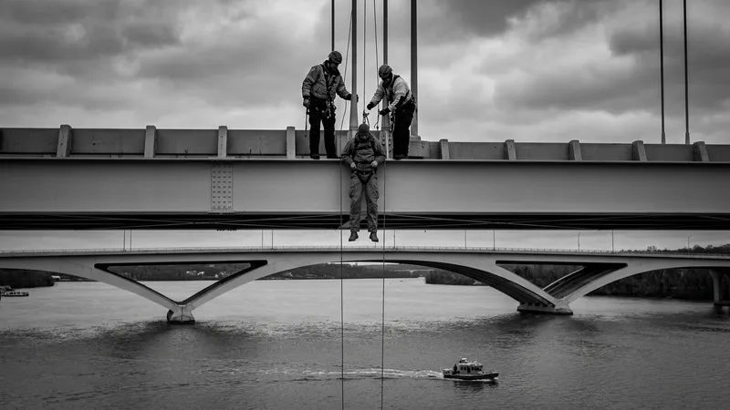 Protester Guido Reichstadter descends from Frederick Douglass Memorial Bridge after nearly a week